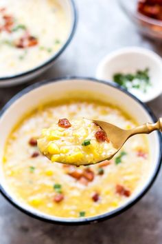 a spoon full of soup with bacon and cheese