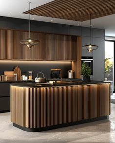 a modern kitchen with wooden cabinets and black counter tops, along with an island in the middle