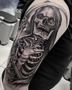 a man with a skeleton tattoo on his arm