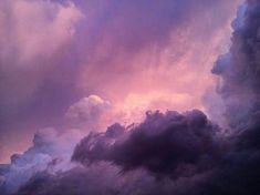 the sky is filled with purple and pink clouds