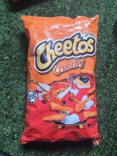 a bag of cheetos candy sitting on the ground