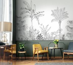 two chairs in front of a wall with plants on it