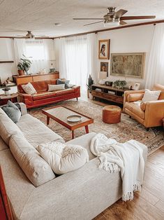 a living room filled with furniture and a fire place