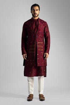 Deep red long nehru jacket with a button at the waist and resham and sequin embroidery. Paired with a long embroidered kurta and cream pant. - Aza Fashions Red Long Sleeve Bandhgala For Designer Wear, Red Designer Nehru Jacket For Festive Occasions, Red Nehru Jacket For Festive Designer Wear, Designer Red Fitted Nehru Jacket, Red Fitted Bollywood Nehru Jacket, Red Fitted Nehru Jacket For Designer Wear, Transitional Red Fitted Bandhgala, Festive Red Long Sleeve Bandhgala, Festive Long Sleeve Red Bandhgala