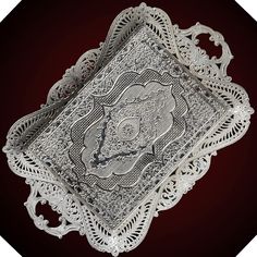 an intricately designed silver tray with ornate designs