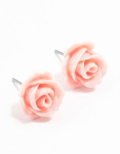 Crafted with a light pink coating, these rose stud earrings exude elegance and femininity. The subtle shine of the coating and classic rose design makes them a timeless accessory to any outfit. Their petite size ensures comfort for all-day wear. Color: Light Pink Dimensions: Length 13 mm x Width 13 mm Weight: 0g | Lovisa Pink Coated Rose Stud Earrings, Light Pink Light Pink Stud Earrings, Pink Heart Stud Earrings, Color Light Pink, Rose Stud Earrings, Colour Light, Timeless Accessories, Rose Design, Petite Size, Color Light