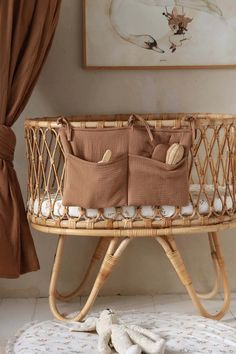 a wicker baby crib with shells in it