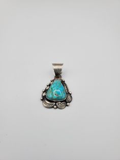 Matted Sterling Silver handcrafted Turquoise Pendant by Navajo Artist G Spencer, wei 17 grams, 2inch by 1 inch, This will be a loved piece of Jewelry by anyone. Traditional Turquoise Jewelry With Patina, Traditional Blue Turquoise Necklace With Patina, Traditional Blue Turquoise Collectible Ring, Traditional Turquoise Necklace With Patina, Handmade Turquoise Necklace Collectible, Handmade Blue Turquoise Collectible Necklace, Handmade Blue Turquoise Necklace Collectible, Unique Engraved Turquoise Necklace, Engraved Turquoise Necklace