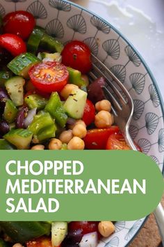 a close up of a salad in a bowl on a table with the words chopped mediterranean salad