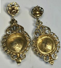 "Pair of 14K yellow gold 19th century Victorian blue enamel and saltwater cultured pearl Victorian dangle style earrings. Attached to the back of each earring is a post and 14K yellow gold friction fit back for fastening. Each earring measures approximately 40.00 mm long and 20.00 mm wide. The saltwater cultured pearls measure approximately 3.00 mm. The pair of earrings weigh 9.90 grams. Stamped \"14K\". The pair of earrings are in beautiful condition. The earrings come in a quality earring box. Antique Earrings With 17 Jewels For Ceremonial Occasions, Victorian Yellow Gold Earrings For Evening, Victorian Hallmarked Jewelry For Opera, Antique Filigree Chandelier Earrings For Formal Occasions, Victorian Gold Plug Earrings, Formal Filigree Baroque Earrings, Formal Baroque Filigree Earrings, Victorian Baroque Formal Jewelry, Victorian Yellow Gold Earrings With Screw Back