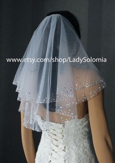 the back of a wedding veil with pearls