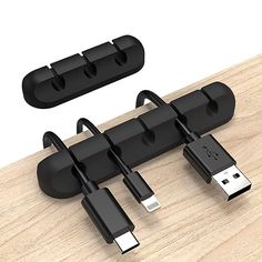 two usb devices connected to each other on a wooden surface