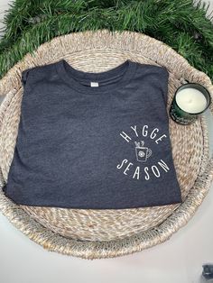 Hygge Season Long Sleeve Tee | Danish T-Shirt Women | Cozy Vibes Shirt | Winter Themed Shirt | Cozy Holiday Shirt | Hygge Lifestyle This Hygge Season long sleeve t shirt is a perfect to snuggle up in with a cup of hot cocoa. Wearing this tshirt will instantly give you Hygge Vibes! We use super soft, high quality Bella Canvas tees. These shirts are Unisex & preshrunk, please see size chart in listing photos for sizing information. Everything is designed, developed, and produced by SunshineSou Cozy Cotton T-shirt For Loungewear, Cozy Cotton T-shirt With Graphic Print, Cozy Crew Neck T-shirt For Loungewear, Cozy Relaxed Fit T-shirt With Graphic Print, Cozy Cotton T-shirt With Letter Print, Cozy Letter Print T-shirt For Loungewear, Cozy Crew Neck T-shirt With Letter Print, Cozy T-shirt With Letter Print For Loungewear, Cozy Cotton Top With Graphic Print