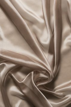 a close up view of a plain, beige colored fabric that is very soft and smooth