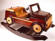 an old fashioned wooden toy car on a white background