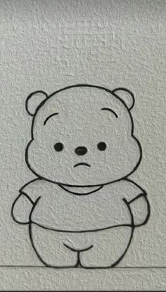 a drawing of a teddy bear on the wall