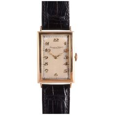 Vintage Swiss IWC rare mens Art Deco wrist watch, circa 1939. This watch features an 18 karat yellow gold case with an Art Deco dial, Breguet Arabic numerals, and restored original dial by the International Watch Company. The watch is marked Schaffhausen and has a rare highest grade hand made 19 jewel movement #679171, case #34661, calibration 10-1/2. Dimensions Case: 43mm H (lug tip to lug tip) x 25mm W (excluding crown) x 8mm D Warranty This watch comes with a full 18 month warranty from the date of purchase. Elegant Collectible Watch With Rectangular Dial, Classic Collectible Watch With Rectangular Dial, Classic Watches With Rectangular Dial For Collectors, Classic Yellow Gold Watch Bands With Rectangular Dial, Classic Jewelry And Watches With Chronometer Rectangular Dial, Art Deco Yellow Gold Rectangular Watch, Classic Jewelry And Watches With Polished Rectangular Dial, Classic Jewelry And Watches With Rectangular Dial, Art Deco Formal Rectangular Watch