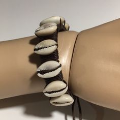 Bracelet Is In Excellent Condition Never Worn. Very Pretty Cowry Shells. Adjustable Leather Cords For Fit. Brown Leather. Unisex Casual Brown Leather Beach Bracelet, Handmade Casual Cream Bracelets, Casual Leather Bracelet For Beach, Casual Handmade Cream Bracelets, Handmade Brown Leather Bracelet For Beach, Adjustable Beige Bracelets For Vacation, Adjustable Beige Bracelet For Vacation, Handmade Casual Cream Jewelry, Casual Cream Jewelry For Beach