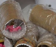 several rolls of brown paper wrapped in plastic