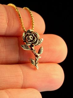 "Slow down and smell the Roses! This solid 14k gold rose charm is 13/16\"\" high and beautifully detailed. If you would like a solid 14k gold chain please select the stye and length from the dropdown menu. If you would prefer a different style or length please contact us. This item usually ships the same or next business day. All Marty Magic Jewelry is packaged in a beautiful purple box, embossed with the gold foil Marty Magic dragon logo. Perfect for any occasion! Designed in Santa Cruz Califor Rose Gold Jewelry With Roses For Formal Occasions, 14k Gold Rose-colored Jewelry With Rose Design, 14k Gold Rose Jewelry With Rose Design, 14k Rose Gold Jewelry With Rose Design, Luxury Rose Design Jewelry As A Gift, 14k Gold Rose Design Flower Pendant Jewelry, 14k Gold Flower Pendant With Rose Design, 14k Gold Jewelry With Rose Design Flower Pendant, Sterling Silver Rose Gold Jewelry With Roses