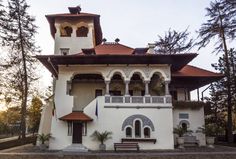 a large white building with a clock tower