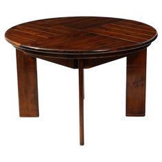 a round wooden table with four legs