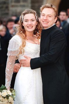 a bride and groom posing for a photo