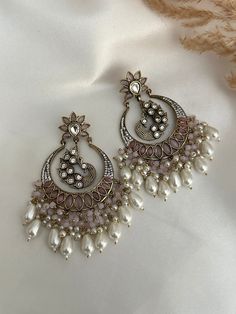 High quality kundan  work classic chandbali with pearl and faux american diamond detailing statement earrings, available in colors.  Lightweight  Dimensions- Earrings length- 3 inches  Style tip- Pair it with any beautiful traditional outfits  and flaunt with Unique style of collection from us. Perfect match for Festival and Traditional wear.  Take Care Tips-  Kee away from perfume, Hair spray and. Moisture.  Store in dry place , Ziplock bag or Airtight box.    Clean with dry cloth.  Jewellery i Luxury Jewelry With Mirror Work For Festivals, Luxury Bridal Chandbali Earrings With Matching Set, Diwali Chandbali Earrings With Mirror Work, Chandbali Chandelier Earrings With Mirror Work For Festivals, Chandbali Earrings With Mirror Work For Festivals, Festival Chandbali Earrings With Mirror Work, Festival Chandbali Chandelier Earrings With Mirror Work, Festive Chandbali Chandelier Earrings With Mirror Work, Festival Mirror Work Chandbali Earrings