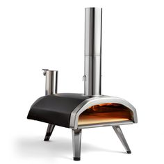 an outdoor pizza oven is shown with the door open to show it's cooking area