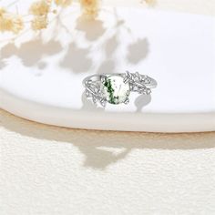 【Unique design】This women's sterling silver ring is inlaid with natural moss agate, which makes the moss agate ring more brilliant, bright and clear glass luster, moss agate inlaid in sterling silver ring, bring you a different visual experience, it is the best gift for sisters, wives, mothers and friends. the noble elegance of the lady.This is a butterfly rings gift for female girls.【Material】925 sterling silver Moss Agate Ring,hypoallergenic,tarnish resistant,nickel-free,lead-free,cadmium-free,suitable for long-term wear,especially sensitive skin men and women.【Ring Size】The ring size:6-9. Package includes: 1 x Moss Agate Ring, 1 x elegant gift box and 1 x silver polishing cloth.【Ring Gift】Moss Agate Ring will come with a elegant gift box, a perfect gift for mom, lover, grandmother, husb Silver Moss Agate Ring With Natural Inclusions, Moss Agate Round Promise Ring, Elegant Silver Crystal Ring With Natural Inclusions, Nature-inspired Moss Agate Round Rings, Nature-inspired Moss Agate Rings, Elegant Silver Moss Agate Rings, Leaves Engagement Ring, Best Gift For Sister, Butterfly Rings