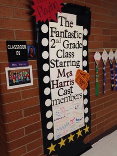 a bulletin board with writing on it in front of a brick wall that reads the fantastic 2nd grade class starting mrs harris's cast members