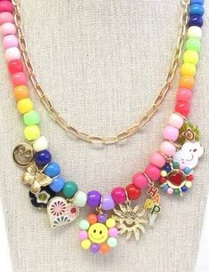 Rainbow beads,  smiley face charms, flowers, sunshine.  and hearts theme multi charm multi layer necklace and gold ball stud earrings set is fun,  happy, and fabulous!!  Size: Length 16 inches on shortest layer the gold tone paper clip chain the necklace has 3 inch extender chain Tone Paper, Love Smiley, Double Layer Necklace, Flowers Butterfly, Multi Layer Necklace, Layer Necklace, Rainbow Beads, Necklace And Earrings Set, Trendy Necklaces