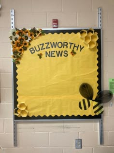 a bulletin board with bees on it and the words buzzworthy news written in yellow