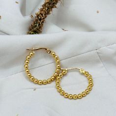 This is a beautiful and perfect everyday earrings. It will make a great gift to a loved one. #birthdaygiftidea #fashionearrings #ballbeadedearrings #perfectgiftideaforsister #mothersdaygiftguide Yellow Gold Beaded Hoop Earrings For Gift, Gold Hoop Beaded Earrings For Pierced Ears, Gold Hypoallergenic Round Bead Earrings, Gold Hypoallergenic Earrings With Round Beads, Nickel-free Yellow Gold Round Bead Earrings, Gold Hypoallergenic Earrings, Gold Earrings With Polished Round Beads, Gold Beaded Earrings For Everyday, Gold Round Beads Earrings For Everyday