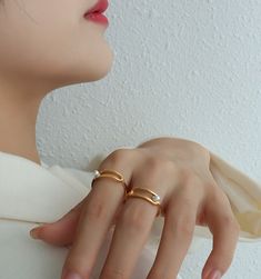 ✦ Indulge in sophistication with our geometric pearl ring, offered in luxurious gold or sleek silver. Plated in radiant 18K gold, this ring boasts a timeless design that combines modern geometric elements with the classic elegance of pearls. Elevate your ensemble with this versatile accessory, perfect for adding a touch of refinement to any look.----------- DETAILS ------------ Color: Gold/ Silver- Ring Size: US 7- Width: 0.6cm- Materials: 18K Gold Plated, Titanium Steel, Pearl- SKU: A201 Everyday Adjustable 14k Gold Pearl Ring, Adjustable Gold Pearl Ring, Minimalist 14k Gold Adjustable Pearl Ring, Elegant Adjustable Pearl Ring With Charm, Luxury Adjustable Gold Pearl Ring, Mismatched Earrings Studs, Geometric Elements, Cats Eye Stone, Geometric Heart