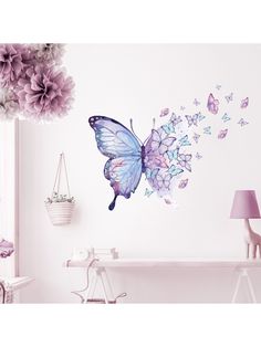 a butterfly wall decal with purple flowers on it