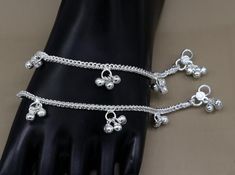 Handmade Sterling silver fabulous jingling noisy ankle bracelet, best charm anklets gifting new born baby jewelry.Metal-Sterling silver.Item type-Baby Anklets.Weight-21.920 grams.Length-5.5 inches.Width-1.5 cm with bells.Makes excellent gifting for birthday or functions, events, ceremony White Metal Anklet Perfect For Gifting, White Metal Anklet As Gift, Personalized Silver Anklets, White Metal Anklets For Gift, Festive Silver Anklets For Puja, Personalized Adjustable Silver Anklets, Festive Silver Anklets With Oxidized Finish, Adjustable Silver Dangle Anklets, Silver Bollywood Anklets For Festivals