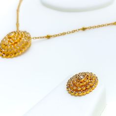 Crafted in 22k yellow gold with a total weight of 23.2 grams, this exquisite set features a necklace and matching earrings, adorned with uncut diamonds (Polki) totaling 5.46 carats. The necklace, at a length of 16 inches, showcases a special layered, domed oval design, complemented by a 1.1-inch drop. It comes with a secure hook lock and adjustable links for a perfect fit. The matching earrings, each 0.75 inches in length, are designed with a screw-back post, ensuring both comfort and style. Thi Polki Necklace Set, Bridal Jewelry Necklace, Precious Stones Rings, Diamond Pendant Sets, Polki Necklace, Modern Bracelets, Fancy Necklace, Fancy Rings, Mens Gold Rings