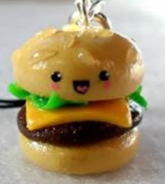 a small toy hamburger with a face on it's bun is sitting on a table