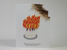 a birthday card with a lit candle on it