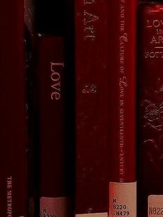 a row of red books with love written on them