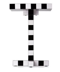 a black and white checkered letter t on a white background with clippings