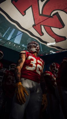 a football player standing in the middle of a tunnel