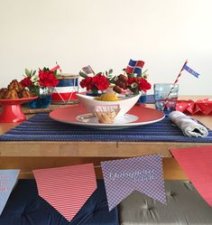 the table is set with red, white and blue decorations