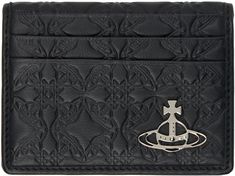 Nappa leather bifold card holder in black. · Graphic pattern embossed throughout · Logo hardware at face · Four card slots at exterior · Six card slots at interior · Two note slots · Nappa leather interior · Moiré lining · H3 x W4 x D0.5 Supplier color: Black Black Luxury Card Holder With Engraved Logo, Luxury Black Card Holder With Engraved Logo, Luxury Embossed Leather Wallet, Luxury Leather Embossed Wallets, Black Leather Card Holder With Engraved Logo, Black Leather Wallet With Engraved Logo, Black Leather Wallets With Engraved Logo, Black Leather Card Holder With Embossed Logo, Vivienne Westwood Wallet