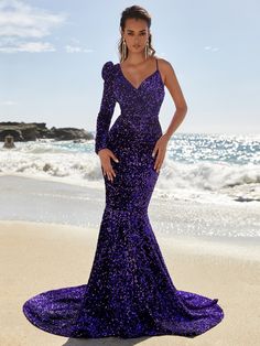 This one shoulder mermaid dress is the perfect choice for your special occasion. It features a sequin embellishment and a zipper up back style. It is fully lined and available in a beautiful purple color. It has a moderate stretch for a comfortable fit. Product Code: FSWD8016 Embellishment: Sequin Fabric: 100% Polyester Back Style: Zipper Up Fully Lined: Yes Built-in Bra: No Available Color: Purple Stretch: Moderate Fits true to size Imported Model Information: Height: 5' 2" Bust: 32'' Waist: 26 Prom Dress Purple, Red Formal Gown, Sequin Mermaid Dress, Beachy Dresses, Leg Of Mutton Sleeve, Sequin Embellishment, Sequin Prom Dress, Work Chic, Women Formals