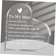 a clear glass heart shaped plaque with the words to my man on it's side