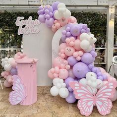 balloons are arranged in the shape of a house and butterfly for a birthday party or baby shower