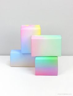 three cubes are stacked on top of each other in the same color as they appear to be painted