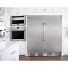 a stainless steel refrigerator in a white kitchen